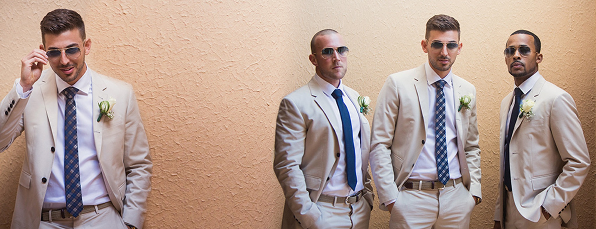 Markwell with his groomsmen in light destination wedding suits