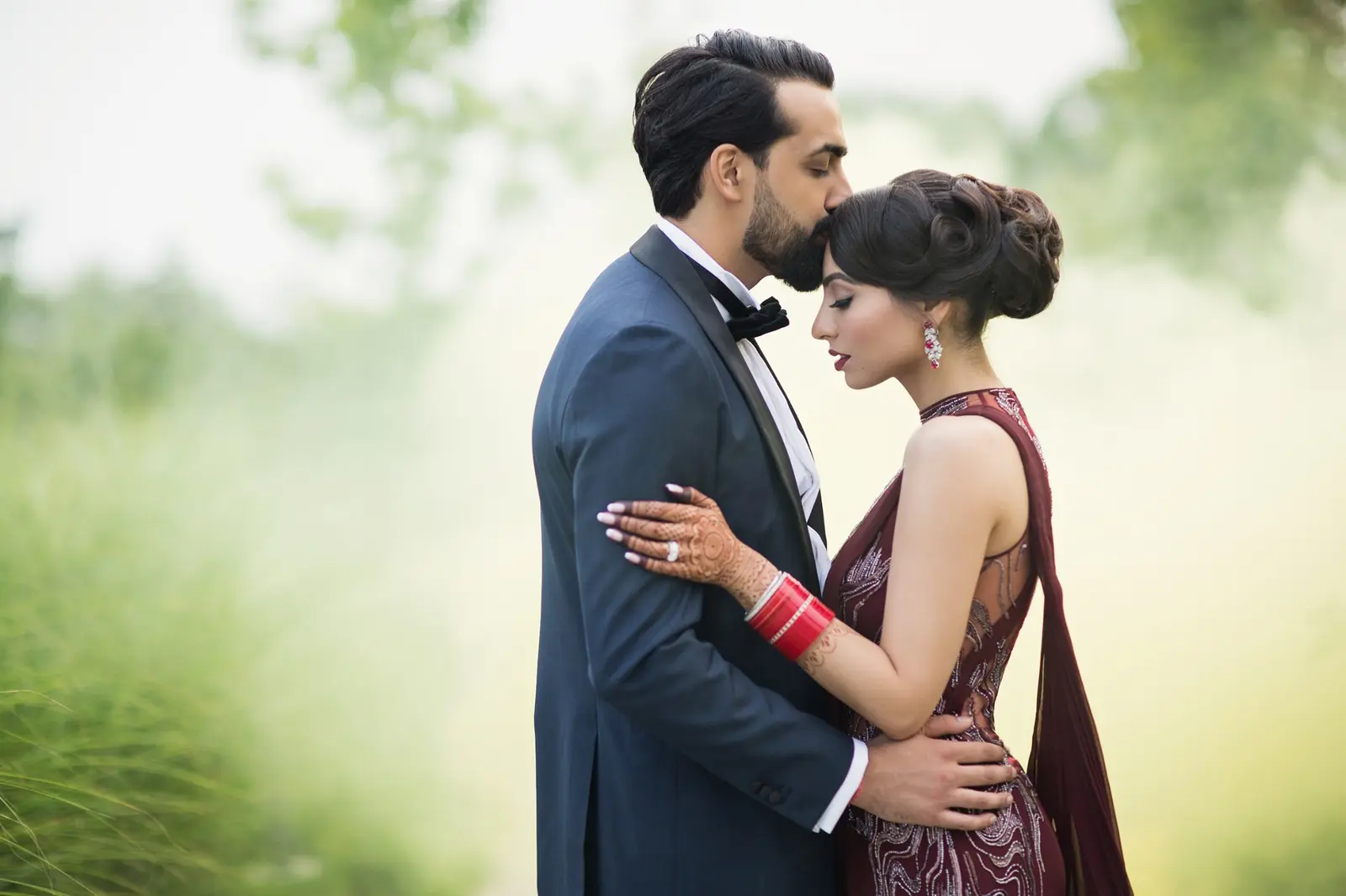 Shivani and Vik sharing a quiet wedding portrait outdoors